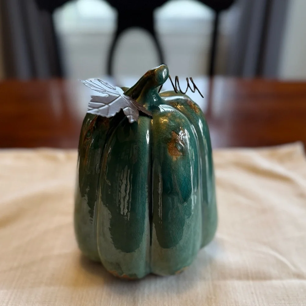 Ceramic pumpkin with metal leaf accent
